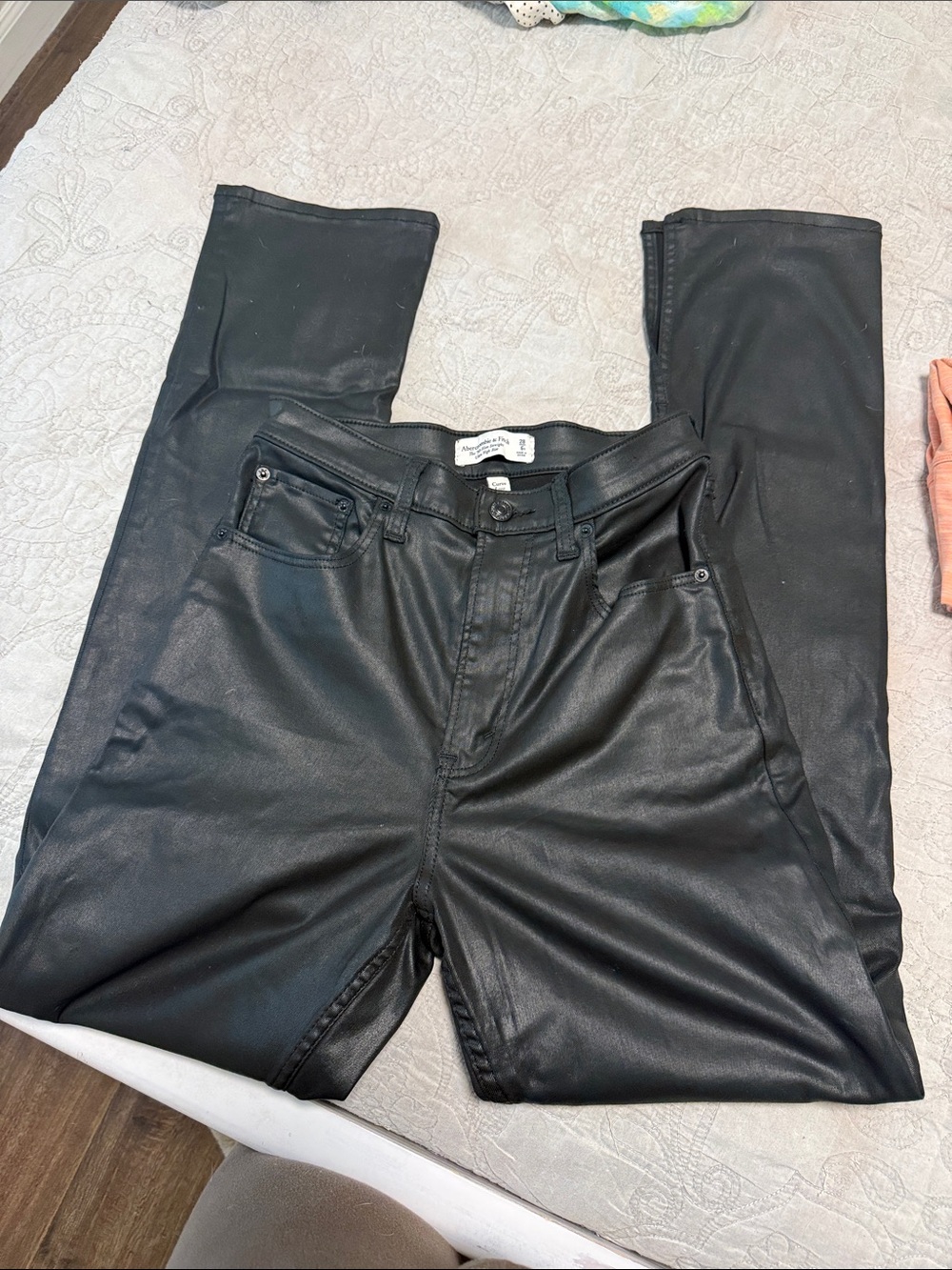 coated shiny black straight leg split hem jeans ultra high rise